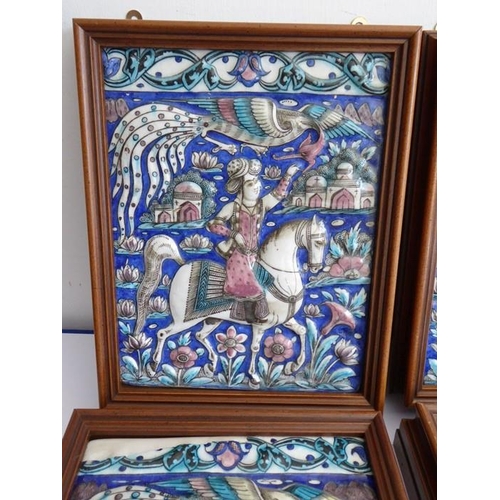 4 - Four early to mid-19th century hand-decorated Persian tiles; each depicting a mounted rider, his lef... 