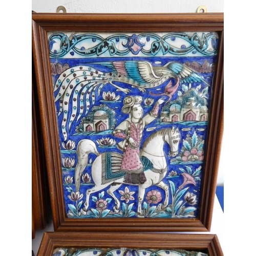 4 - Four early to mid-19th century hand-decorated Persian tiles; each depicting a mounted rider, his lef... 