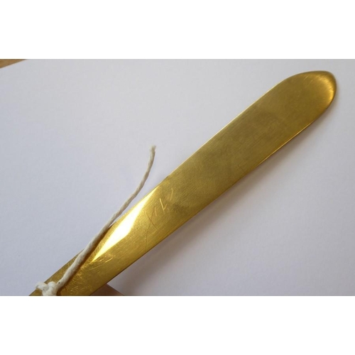 405 - An unusual 19th century gilt-metal letter opener; the flat pointed blade locating into a finely cast... 