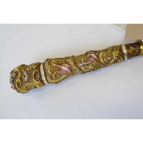 405 - An unusual 19th century gilt-metal letter opener; the flat pointed blade locating into a finely cast... 