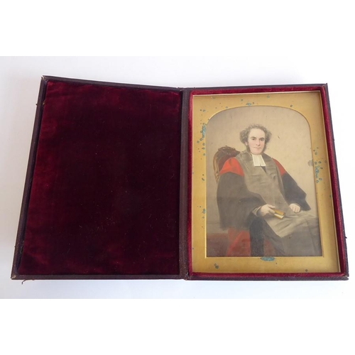 411 - A cased pair of 19th century three-quarter length watercolour portrait miniature studies, a man of t... 