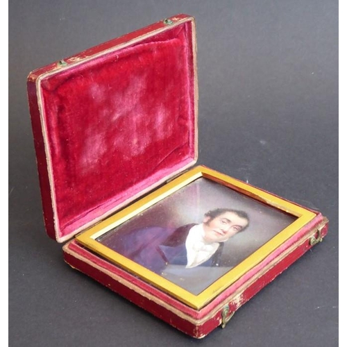 419 - A mid-19th century red Morocco cased shoulder-length portrait miniature on card; a gentleman with da... 