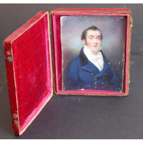 419 - A mid-19th century red Morocco cased shoulder-length portrait miniature on card; a gentleman with da... 