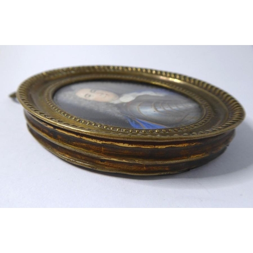 426 - A fine oval brass-cased shoulder-length 17th-century-style (possibly period) portrait miniature; the... 