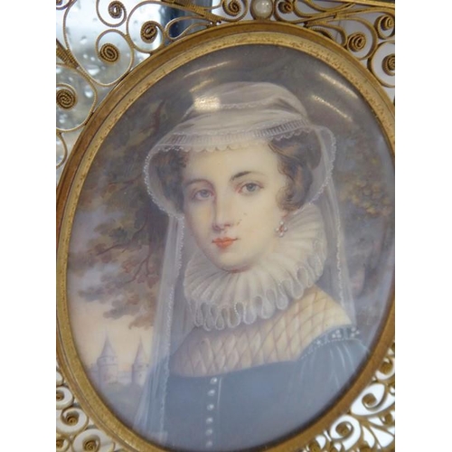 428 - An oval portrait miniature of Mary Queen of Scots in 16th century style: faux tortoiseshell and gilt... 