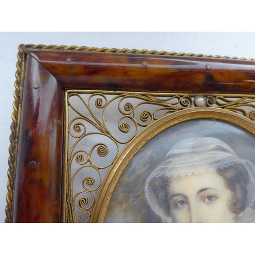 428 - An oval portrait miniature of Mary Queen of Scots in 16th century style: faux tortoiseshell and gilt... 