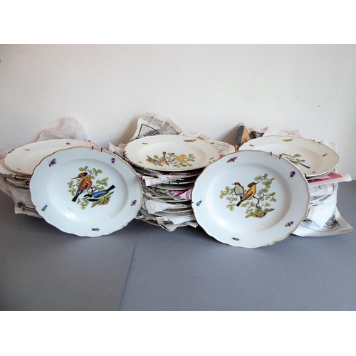 45 - A long and rare set of 36 late 19th century Meissen porcelain dishes; each with shaped gilded border... 