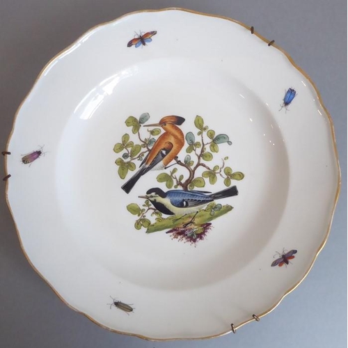 45 - A long and rare set of 36 late 19th century Meissen porcelain dishes; each with shaped gilded border... 