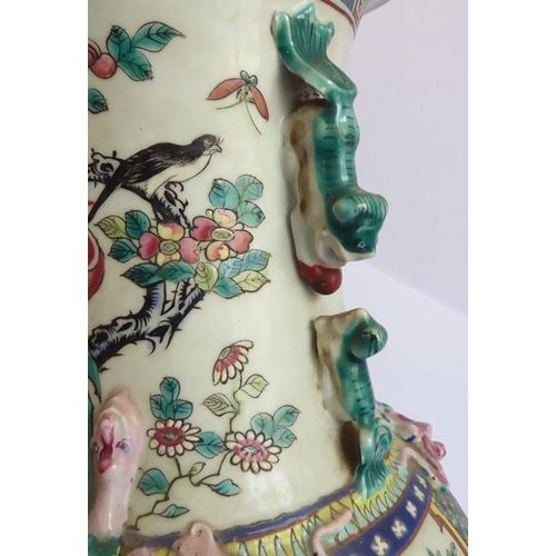 51 - A large mid-19th century Chinese porcelain vase of baluster form; the flaring neck above a multi-col... 