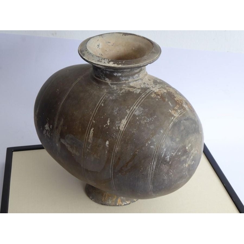 52 - A Chinese Han Dynasty (206 BC - AD 220) incised cocoon jar. Grey, flared circular neck with incised ... 