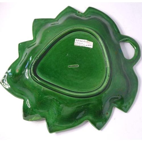 53 - A set of four finely moulded green leaf ceramic dishes, together with one other similar example with... 