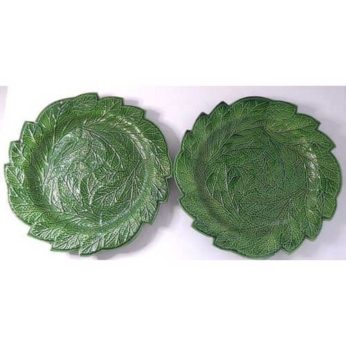 53 - A set of four finely moulded green leaf ceramic dishes, together with one other similar example with... 