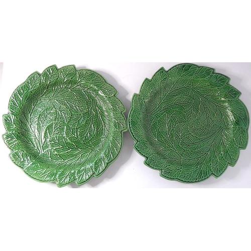 53 - A set of four finely moulded green leaf ceramic dishes, together with one other similar example with... 