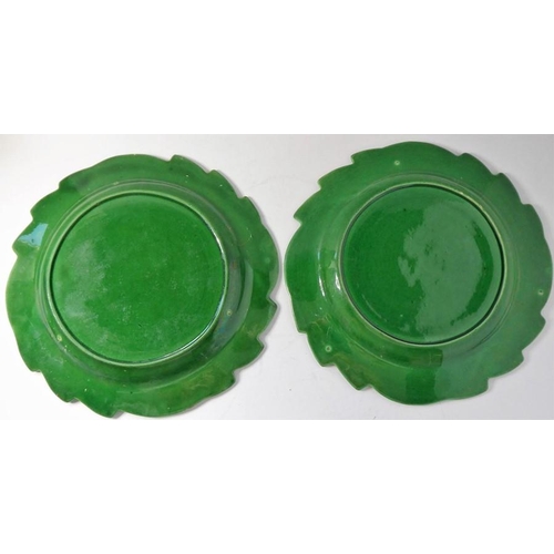 53 - A set of four finely moulded green leaf ceramic dishes, together with one other similar example with... 