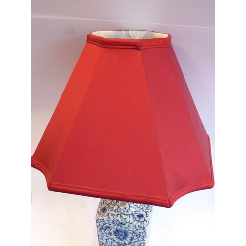 59 - A Chinese porcelain vase (now as a lamp); the tapering triangular red silk lampshade with concave co... 