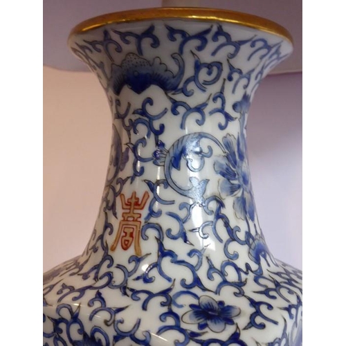 59 - A Chinese porcelain vase (now as a lamp); the tapering triangular red silk lampshade with concave co... 