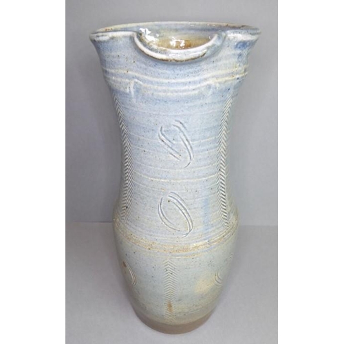 61 - Ray Finch (British, 1914-2012) studio pottery - a reglazed jug with applied handle and incised decor... 