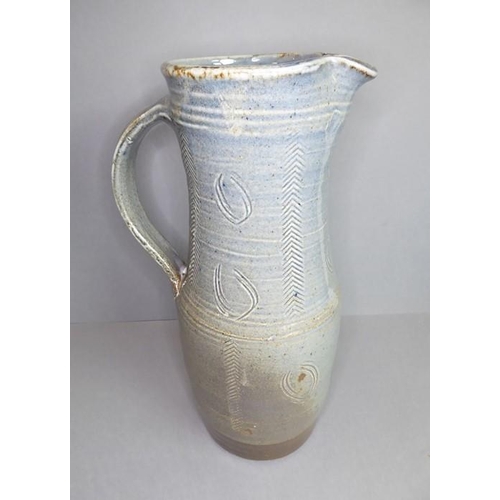 61 - Ray Finch (British, 1914-2012) studio pottery - a reglazed jug with applied handle and incised decor... 