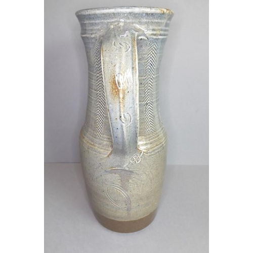 61 - Ray Finch (British, 1914-2012) studio pottery - a reglazed jug with applied handle and incised decor... 