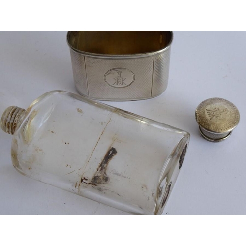 64 - A 19th century transparent glass and silver-mounted hip flask; both the engine-turned screw-top and ... 