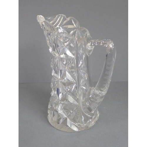 68 - A very heavy hand-cut 19th century crystal jug; with star-cut base and fluted-style cutting to upper... 