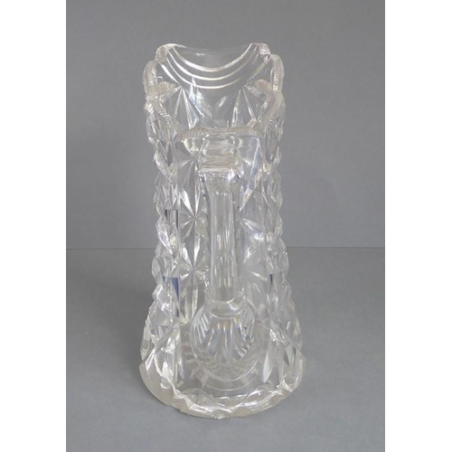 68 - A very heavy hand-cut 19th century crystal jug; with star-cut base and fluted-style cutting to upper... 