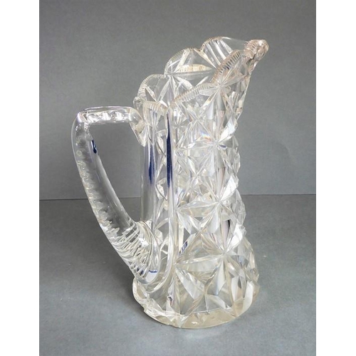 68 - A very heavy hand-cut 19th century crystal jug; with star-cut base and fluted-style cutting to upper... 