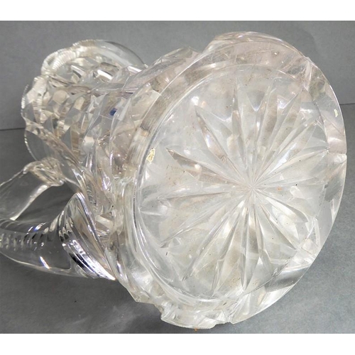 68 - A very heavy hand-cut 19th century crystal jug; with star-cut base and fluted-style cutting to upper... 