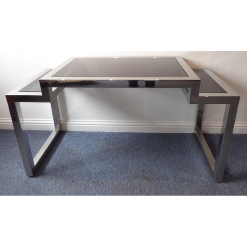 704 - A J. Robert Scott, Inc. 'Rialto' writing table; the polished steel square sectional tubular frame wi... 