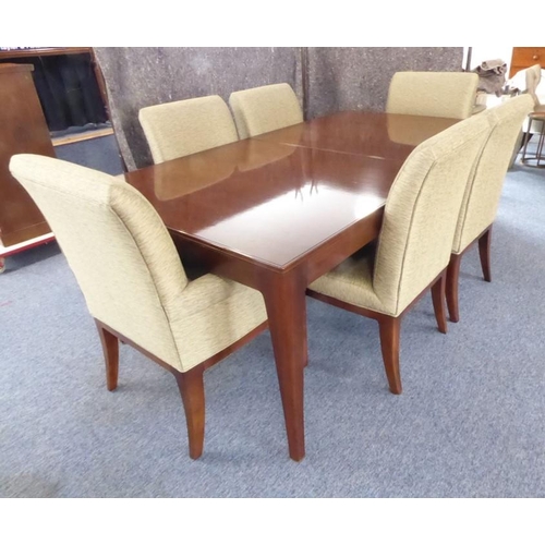 709 - A Baker Furniture 'Cheval' walnut extending dining table with six 'Quebec 69' chairs: the table and ... 