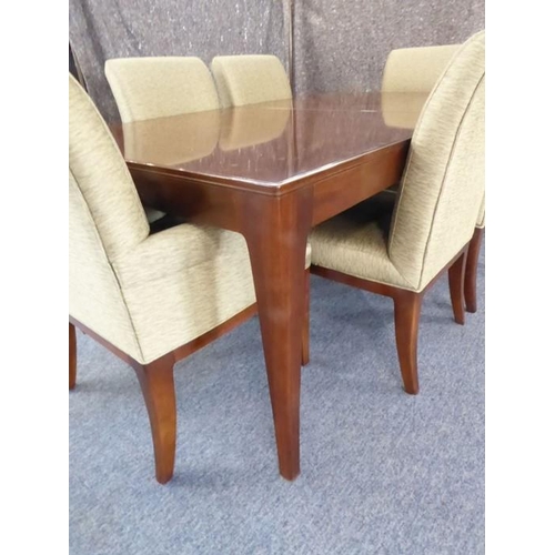 709 - A Baker Furniture 'Cheval' walnut extending dining table with six 'Quebec 69' chairs: the table and ... 