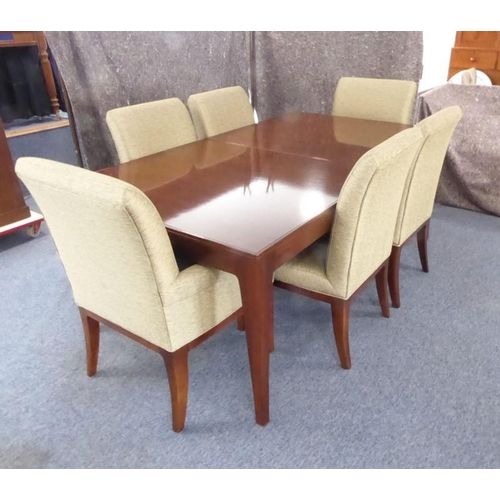 709 - A Baker Furniture 'Cheval' walnut extending dining table with six 'Quebec 69' chairs: the table and ... 