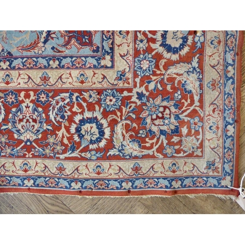 722 - A very fine Persian Isfahan rug; wool with highlights of silk, central oval medallion against an ivo... 