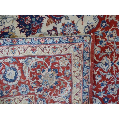 722 - A very fine Persian Isfahan rug; wool with highlights of silk, central oval medallion against an ivo... 