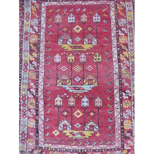 725 - A Turkish rug; early 20th century (150cm (5'0