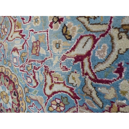 726 - A large Persian carpet (possibly Meshad); early 20th century, central sky-blue medallion against an ... 