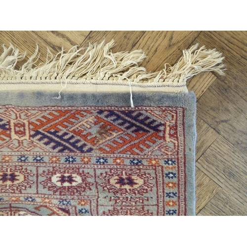 730 - A light-blue ground Pakistan runner with gul pattern (480cm x 79cm)