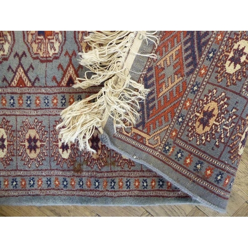 730 - A light-blue ground Pakistan runner with gul pattern (480cm x 79cm)