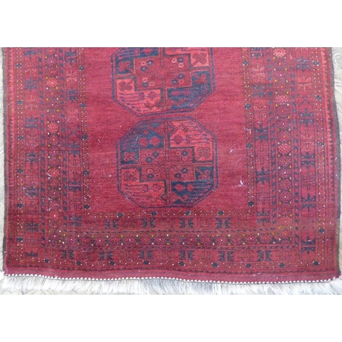 733 - An Afghan rug; circa 1900, north Afghanistan (213cm (7'0