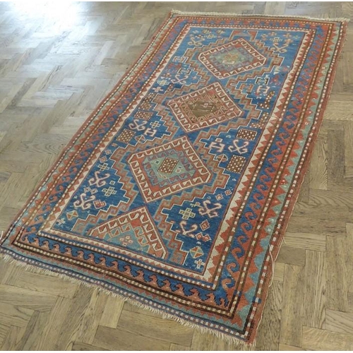 737 - South-west Caucasus, a Kazak rug; circa 1900, three and a half lozenges against a blue field within ... 