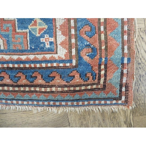 737 - South-west Caucasus, a Kazak rug; circa 1900, three and a half lozenges against a blue field within ... 