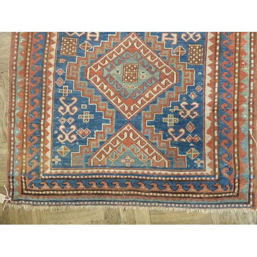 737 - South-west Caucasus, a Kazak rug; circa 1900, three and a half lozenges against a blue field within ... 