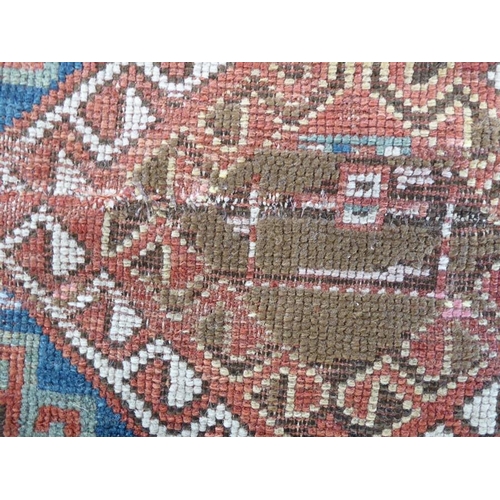 737 - South-west Caucasus, a Kazak rug; circa 1900, three and a half lozenges against a blue field within ... 