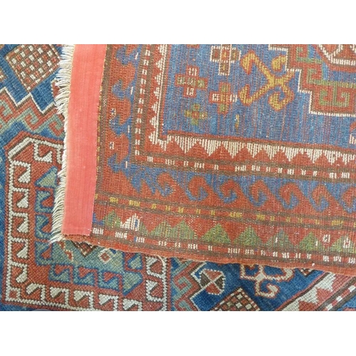 737 - South-west Caucasus, a Kazak rug; circa 1900, three and a half lozenges against a blue field within ... 