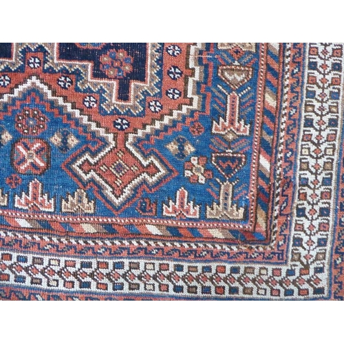 739 - A south Persia Afshar; circa 1900, triple medallion against an indigo-blue ground (147cm x 115cm)