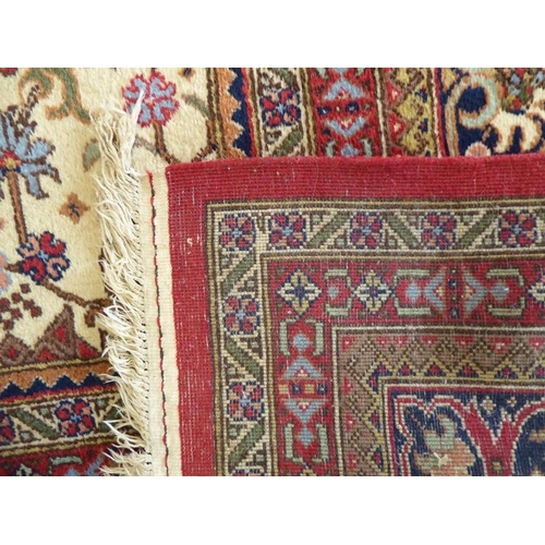 744 - A large and exceptional north-west Persia carpet (signed to one end); central four-point multicolour... 