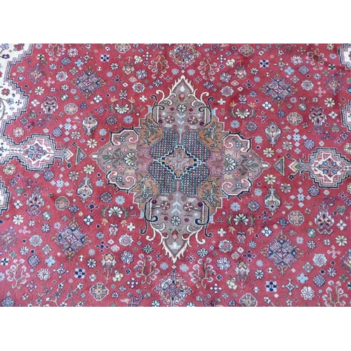 744 - A large and exceptional north-west Persia carpet (signed to one end); central four-point multicolour... 