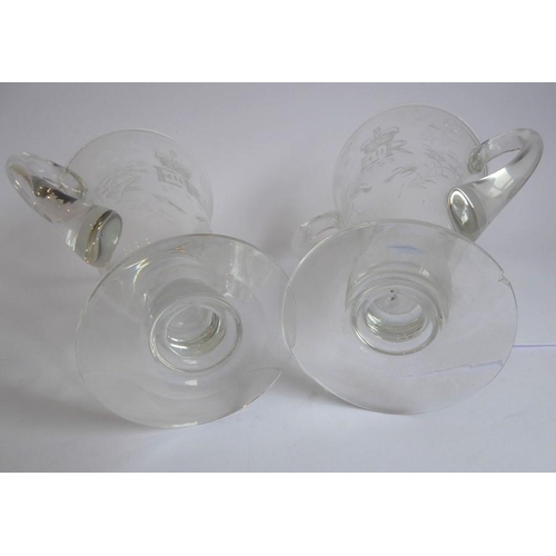 75 - A pair of mid-20th century two-handled clear-glass vases foliates engraved and with the cypher of El... 