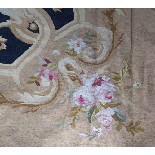 757 - An unlined Aubusson tapestry in a floral geometric pattern in black and beige with a central floral ... 