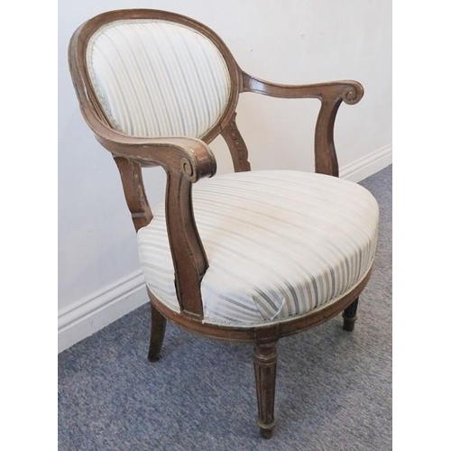 764 - A late 19th / early 20th century upholstered oak open-armed fauteuil; in French style, blue and ligh... 